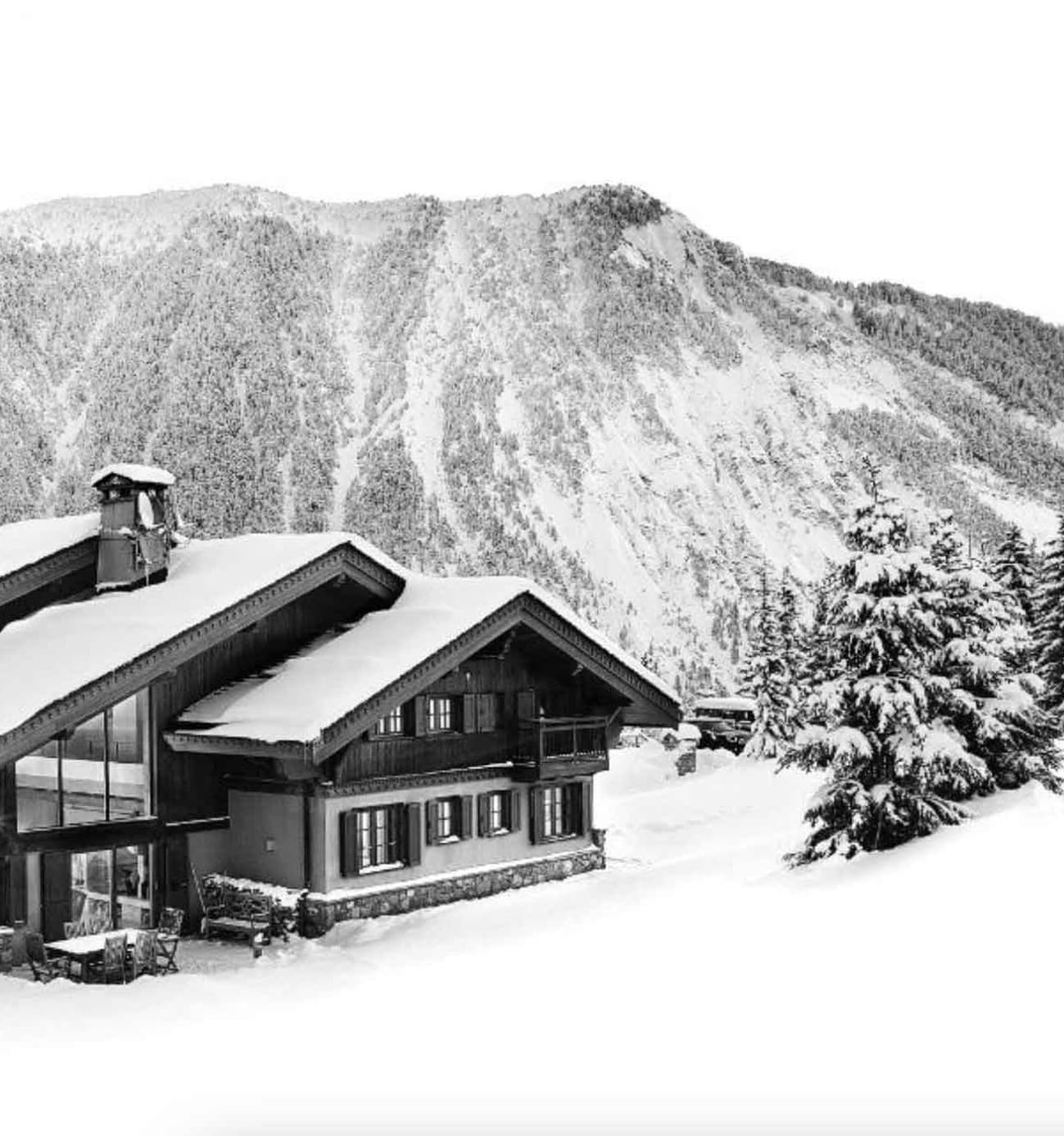 Luxury chalet under the snow, black and white